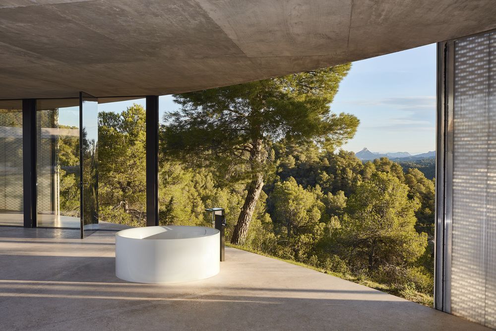 Open air bathroom looking out at forest views