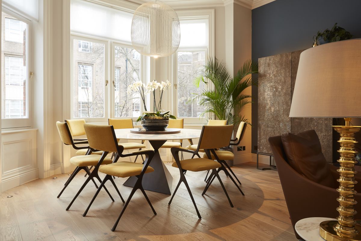 Pendant light with recessed spot lights over Tom Faulkner Table