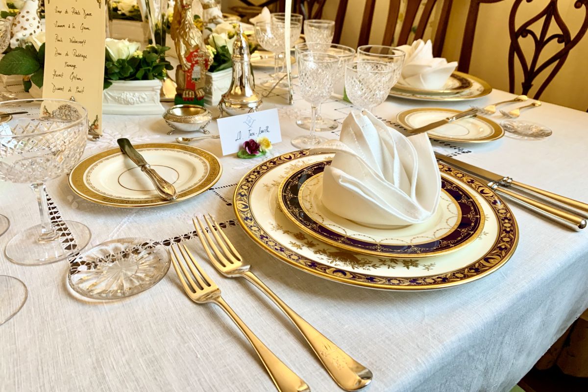 Table set with early 20th century Minton porcelain, Georgian sterling silver and Edwardian English cut glass. 