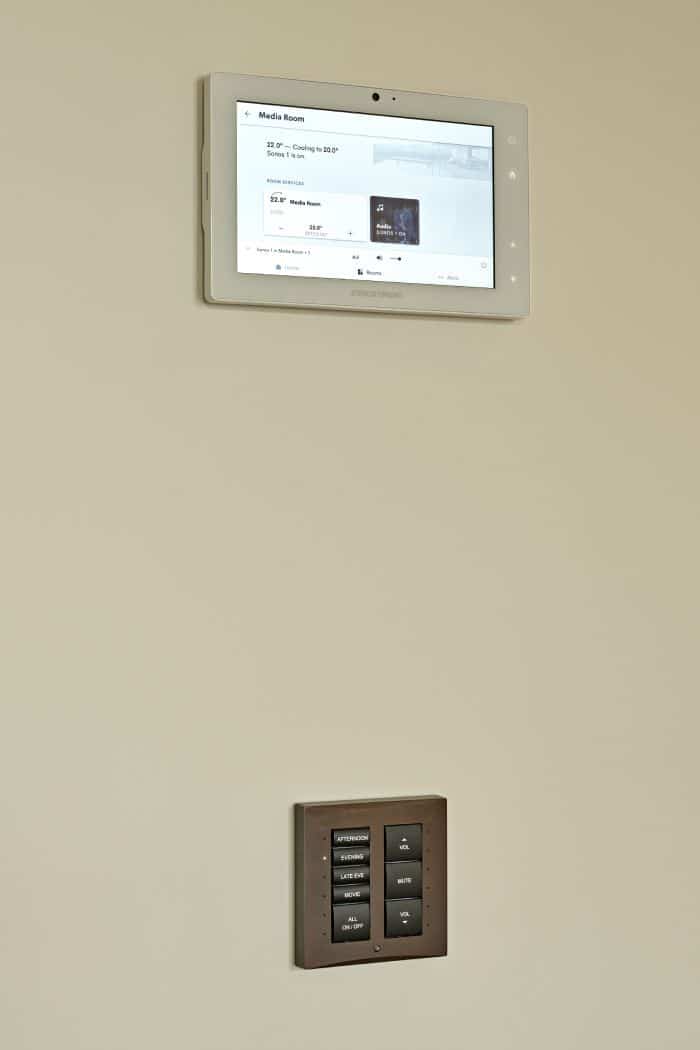 Crestron home control screen and control keypad in bronze.