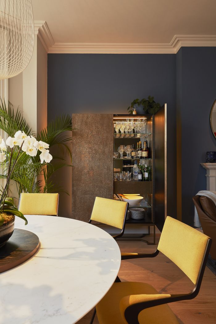 Luxury metallic drinks cabinet in dining room. 