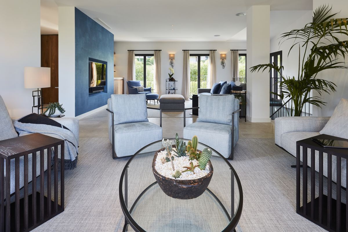 A madison oval coffee table from Tom Faulkner in neutral toned ocean view living room. 