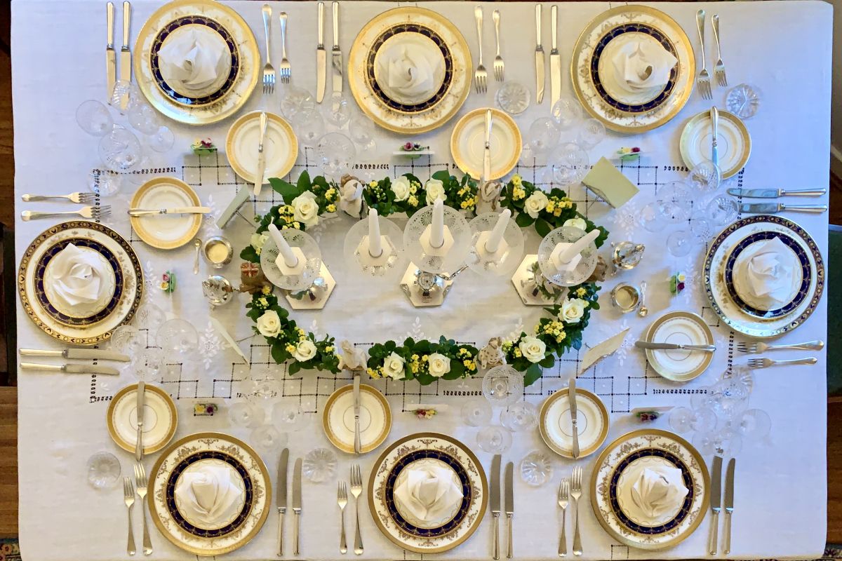 Table set with early 20th century Minton porcelain, Georgian sterling silver and Edwardian English cut glass.