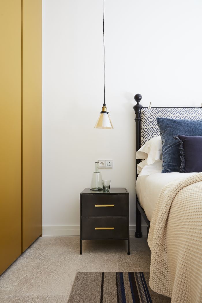 An original bedstead company bed with flexform Ochre colour wardrobe.