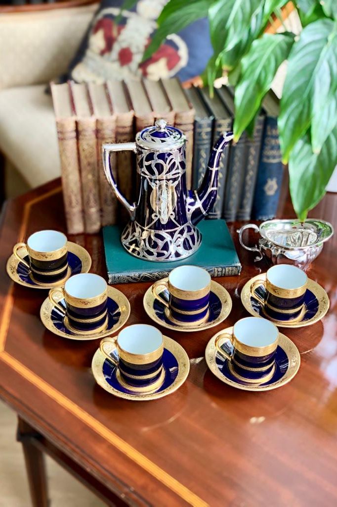 Set of Limoges porcelain coffee cups with and American Lenox porcelain silver overlay coffee pot, c.1910