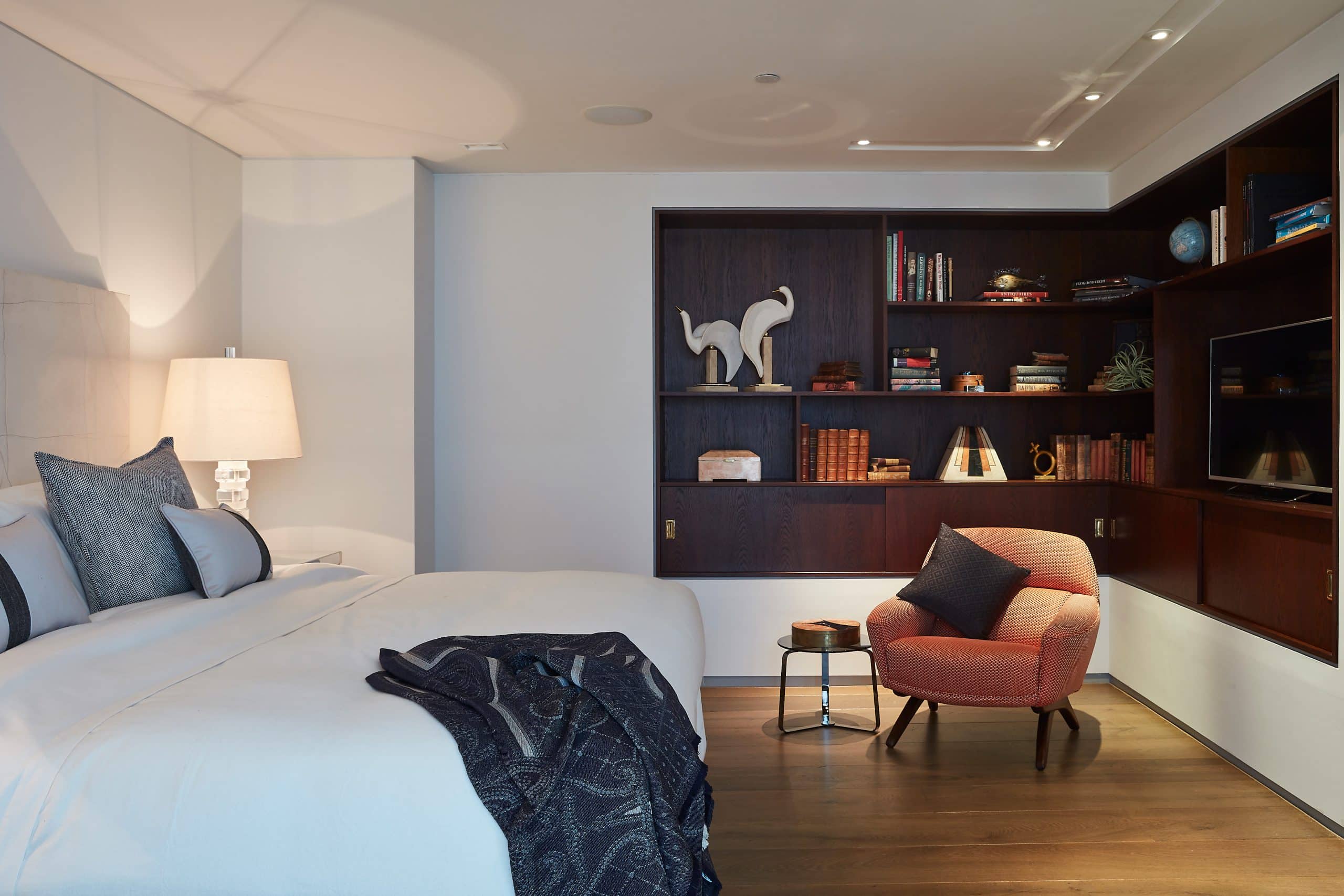 Walnut joinery creates a warm focal point in the corner of the principle bedroom. 