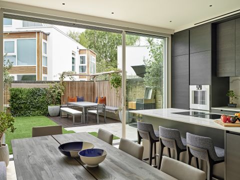 Floor to ceiling glass doors in kitchen opening to the garden.