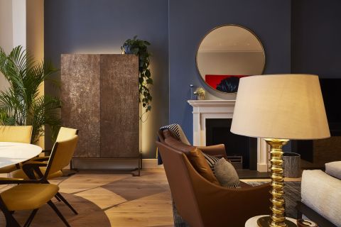 Luxury living room with dark blue walls.