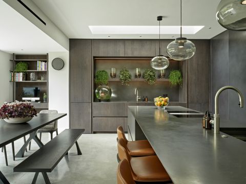 Earth tone elegant sleek modern moody kitchen in London home.