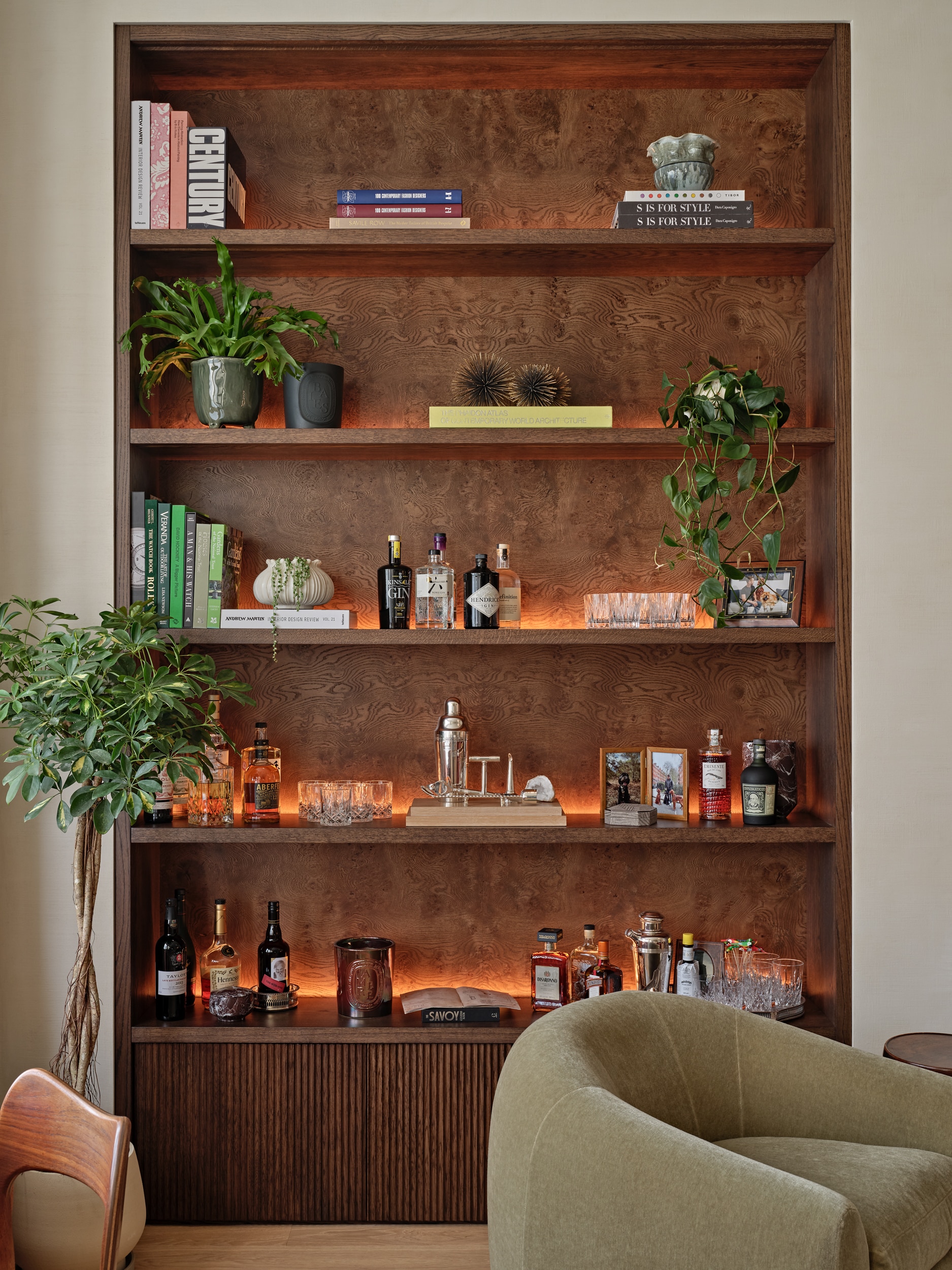 Wooden bespoke joinery in Central London flat. The joinery is lit up from the back with dimmable light to adjust to the natural lights.